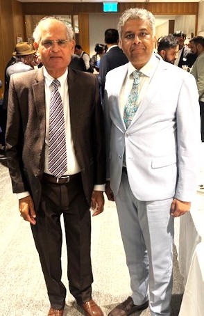 A couple of men in suits

AI-generated content may be incorrect.