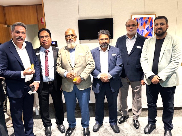 A group of men standing together

AI-generated content may be incorrect.