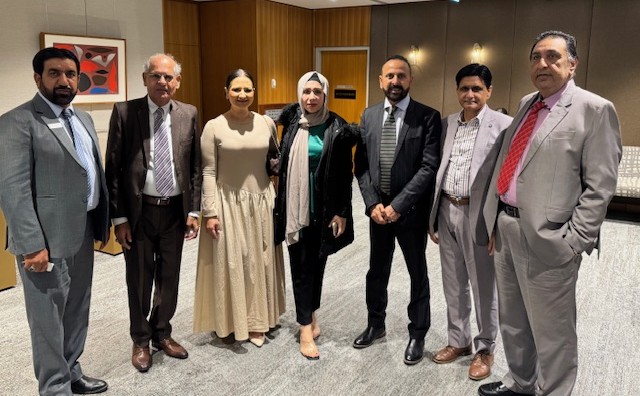 A group of people posing for a photo

AI-generated content may be incorrect.