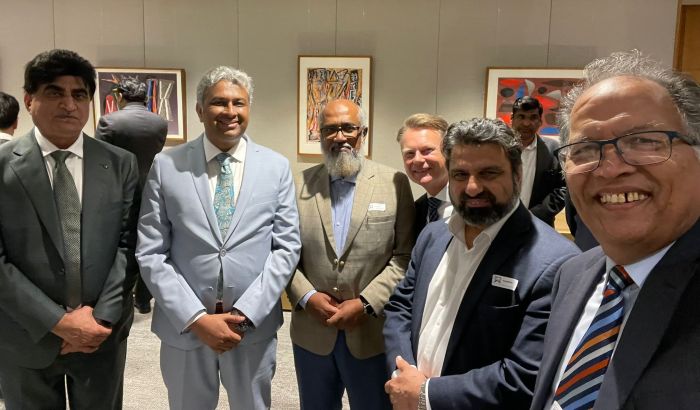 A group of men standing together

AI-generated content may be incorrect.