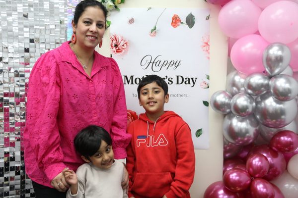 A person and two children posing for a picture

AI-generated content may be incorrect.