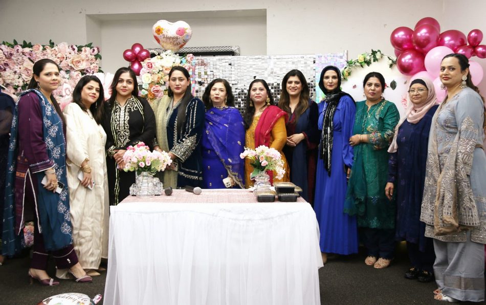 A group of women standing together

AI-generated content may be incorrect.