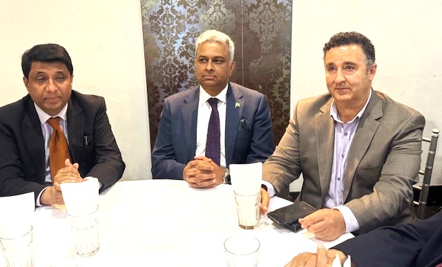 A group of men sitting at a table

AI-generated content may be incorrect.