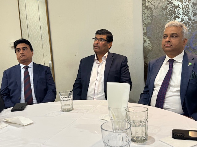 A group of men sitting at a round table

AI-generated content may be incorrect.