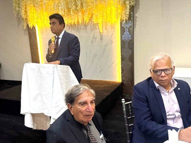 A group of men sitting in a room

AI-generated content may be incorrect.