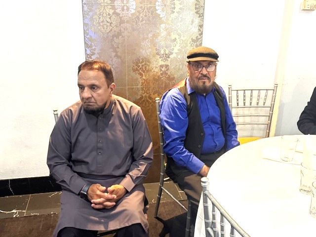 Two men sitting at a table

AI-generated content may be incorrect.