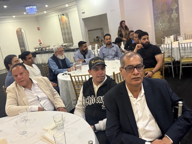 A group of people sitting at tables

AI-generated content may be incorrect.