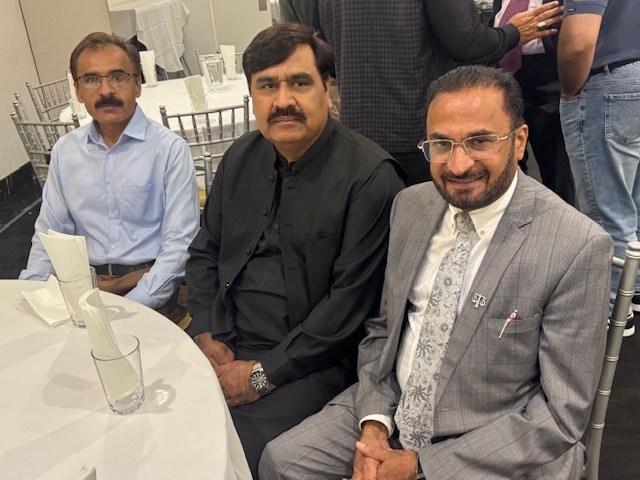 A group of men sitting at a table

AI-generated content may be incorrect.