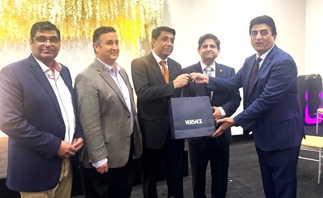 A group of men in suits holding a bag

AI-generated content may be incorrect.