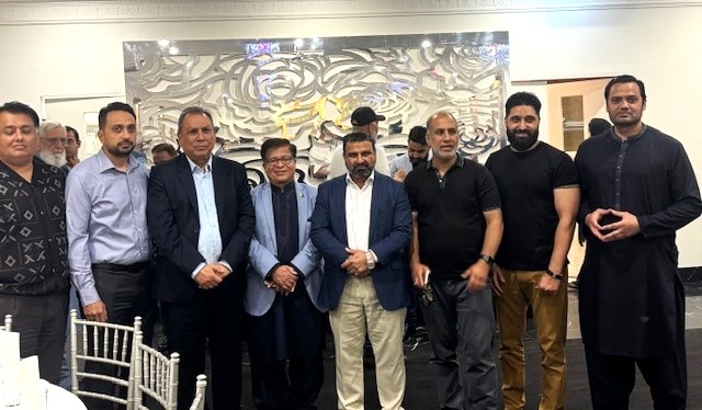 A group of men standing together

AI-generated content may be incorrect.