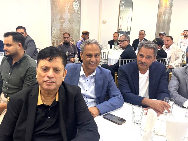 A group of men sitting at a table

AI-generated content may be incorrect.