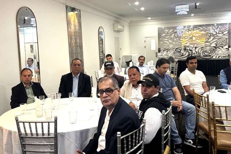 A group of people sitting at tables

AI-generated content may be incorrect.