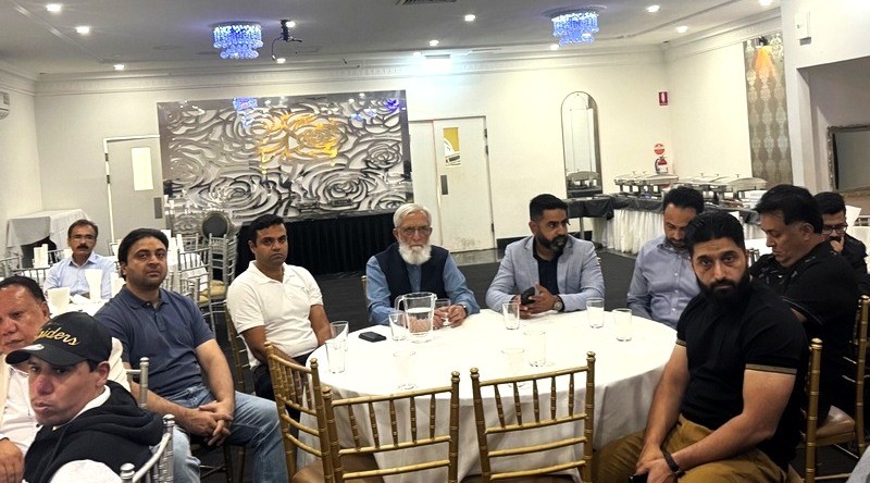 A group of men sitting around a round table

AI-generated content may be incorrect.