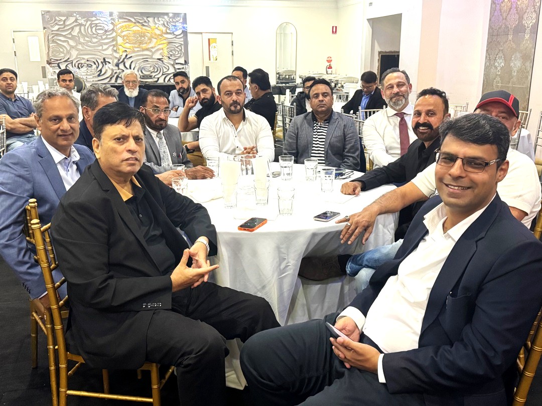 A group of men sitting around a table

AI-generated content may be incorrect.