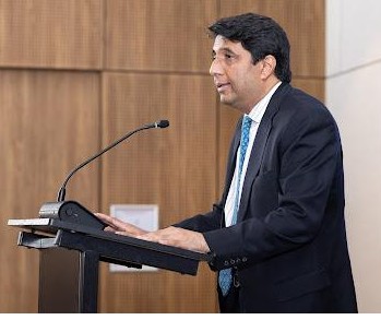 A person standing at a podium

AI-generated content may be incorrect.