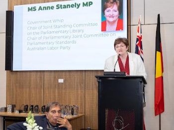 A person standing at a podium

AI-generated content may be incorrect.