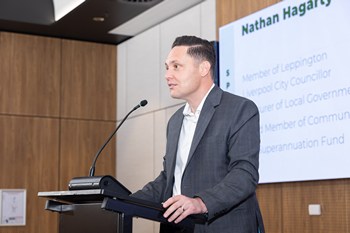 A person standing at a podium

AI-generated content may be incorrect.