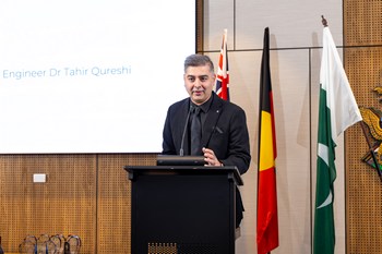 A person standing at a podium

AI-generated content may be incorrect.