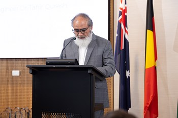 A person standing at a podium

AI-generated content may be incorrect.