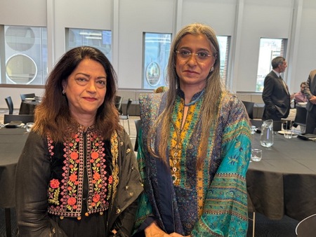 Two women sitting at a table

AI-generated content may be incorrect.