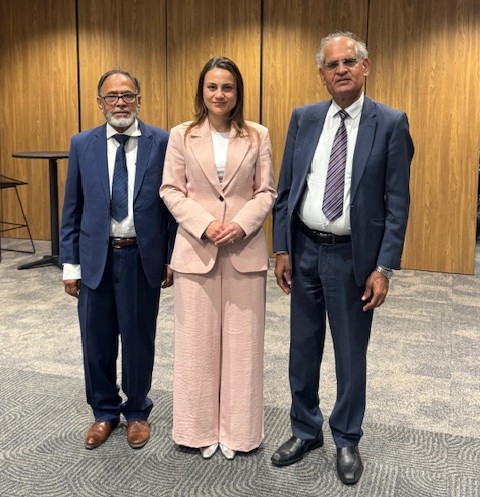 A group of people standing together

AI-generated content may be incorrect.