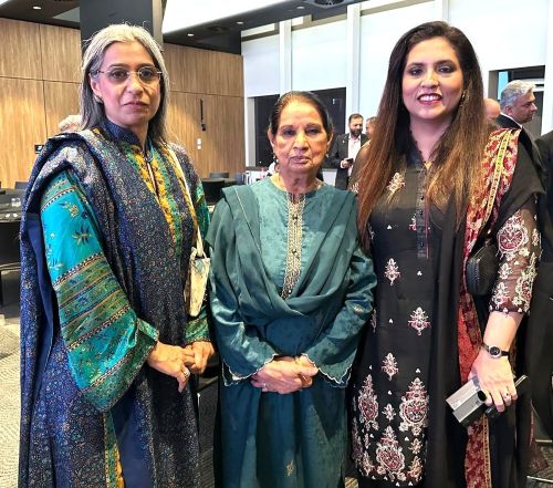 A group of women standing together

AI-generated content may be incorrect.