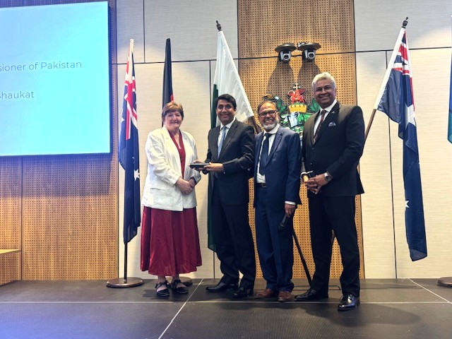 A group of people standing in front of flags

AI-generated content may be incorrect.