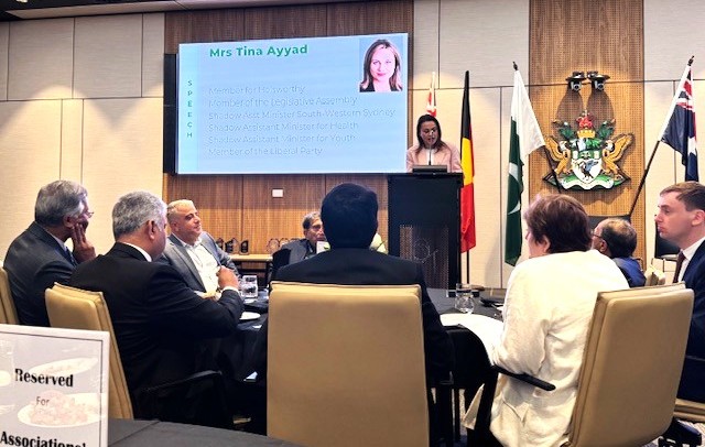 A group of people sitting around a table

AI-generated content may be incorrect.