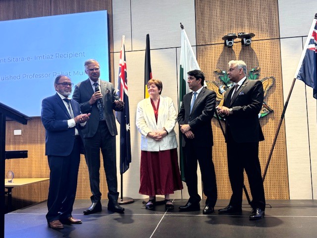 A group of people standing on a stage

AI-generated content may be incorrect.