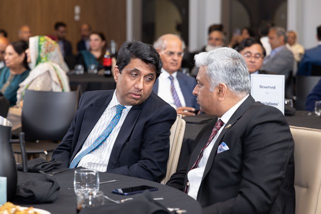 A group of men sitting at a table

AI-generated content may be incorrect.