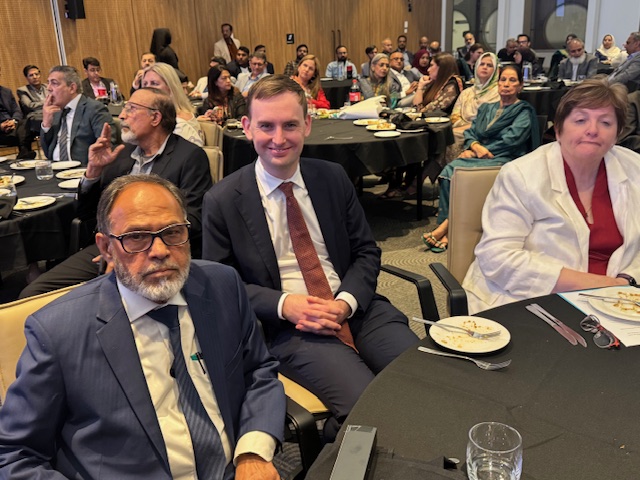 A group of people sitting at a table

AI-generated content may be incorrect.