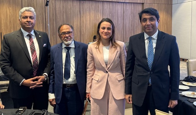 A group of people standing together

AI-generated content may be incorrect.