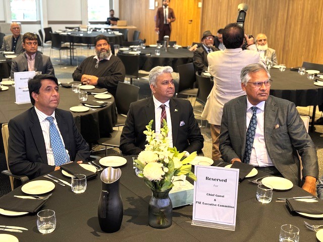 A group of men sitting at round tables

AI-generated content may be incorrect.