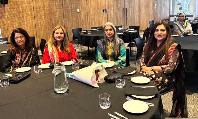 A group of women sitting at a table

AI-generated content may be incorrect.