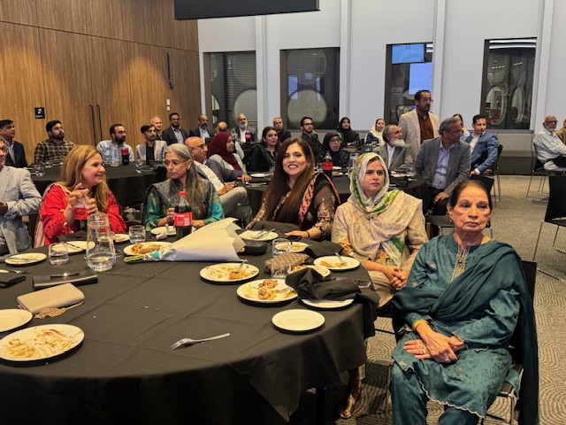 A group of people sitting at a table

AI-generated content may be incorrect.