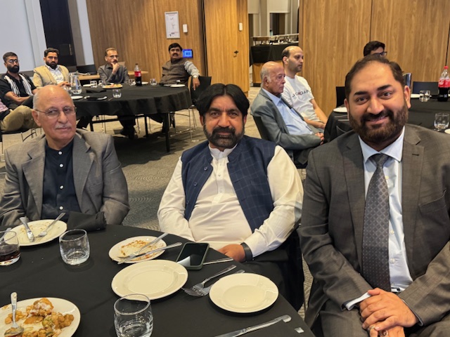 A group of men sitting at a table

AI-generated content may be incorrect.