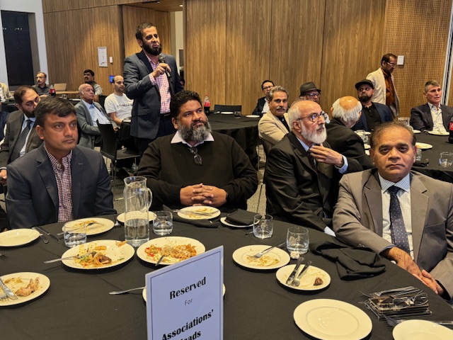 A group of men sitting at a table

AI-generated content may be incorrect.