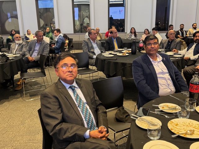 A group of people sitting at tables

AI-generated content may be incorrect.