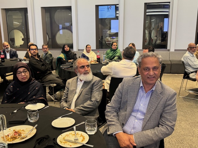 A group of people sitting at a table

AI-generated content may be incorrect.