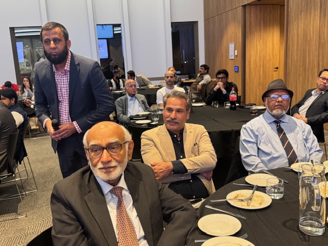 A group of men sitting at a table

AI-generated content may be incorrect.