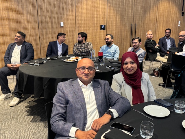 A group of people sitting at round tables

AI-generated content may be incorrect.