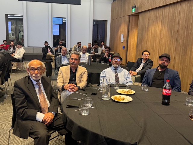 A group of men sitting at a round table

AI-generated content may be incorrect.