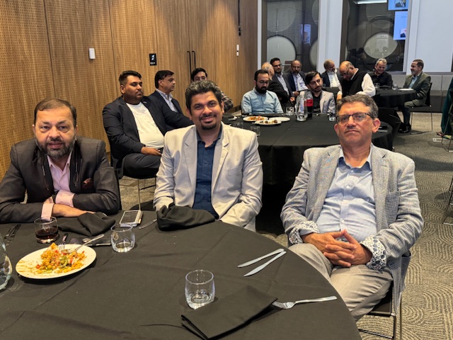 A group of men sitting at a round table

AI-generated content may be incorrect.