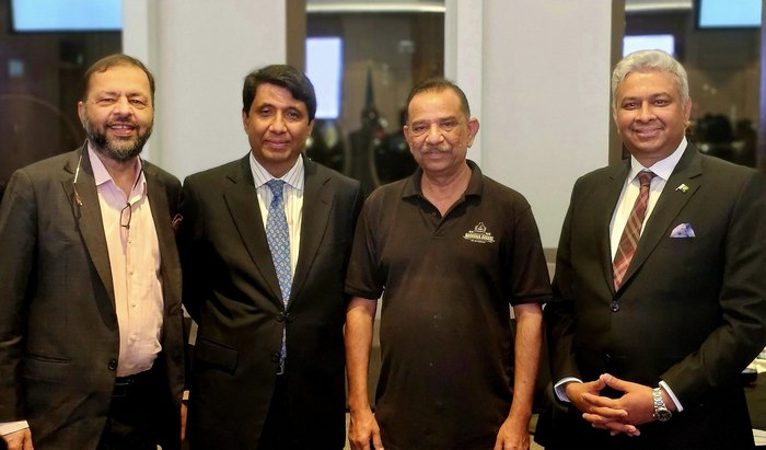 A group of men standing together

AI-generated content may be incorrect.