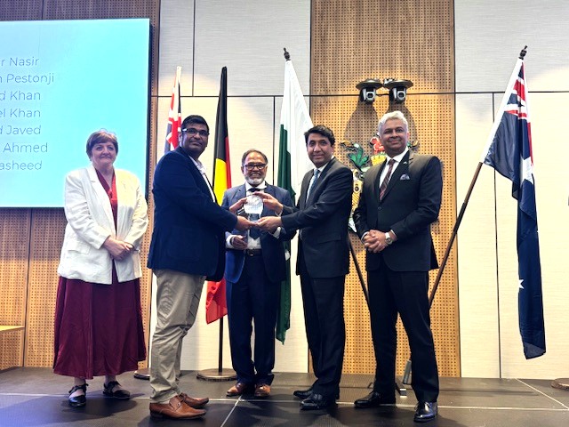 A group of people posing for a photo

AI-generated content may be incorrect.