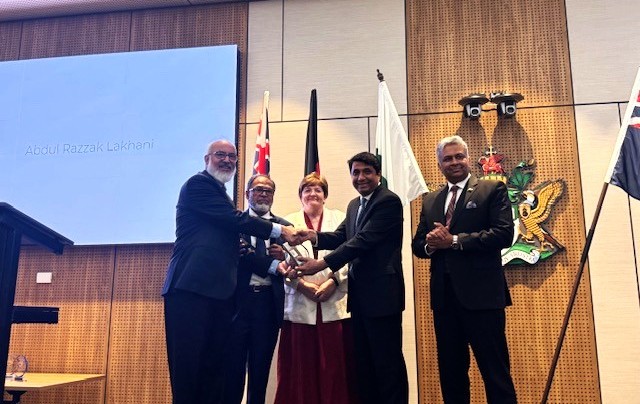 A group of people shaking hands

AI-generated content may be incorrect.