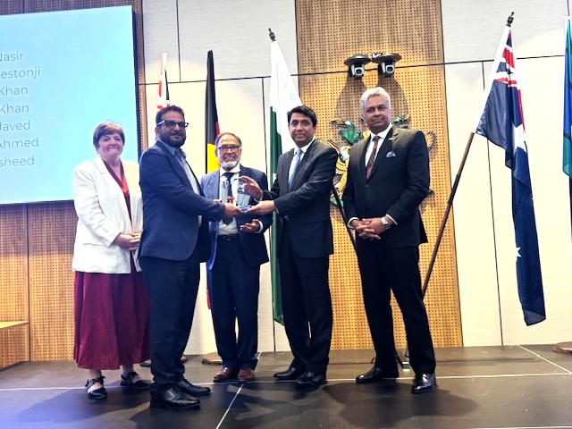 A group of people shaking hands

AI-generated content may be incorrect.