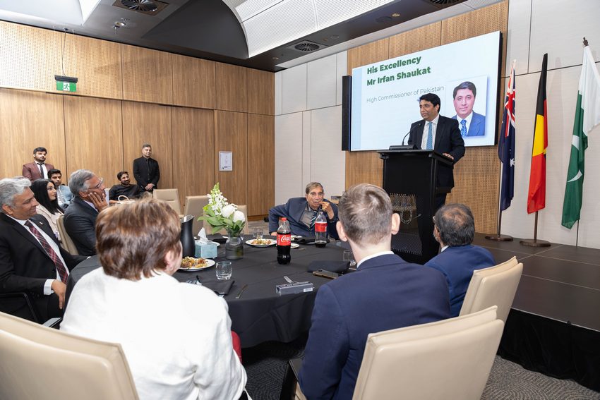 A person standing at a podium giving a presentation to a group of people

AI-generated content may be incorrect.