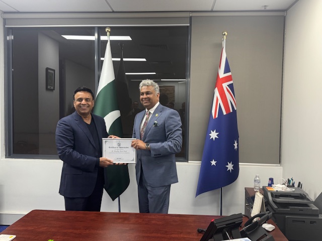 Two men in suits holding a certificate

AI-generated content may be incorrect.