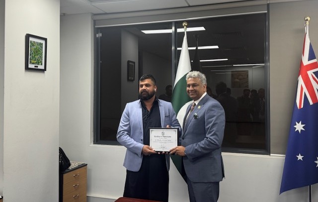 Two men holding a certificate

AI-generated content may be incorrect.